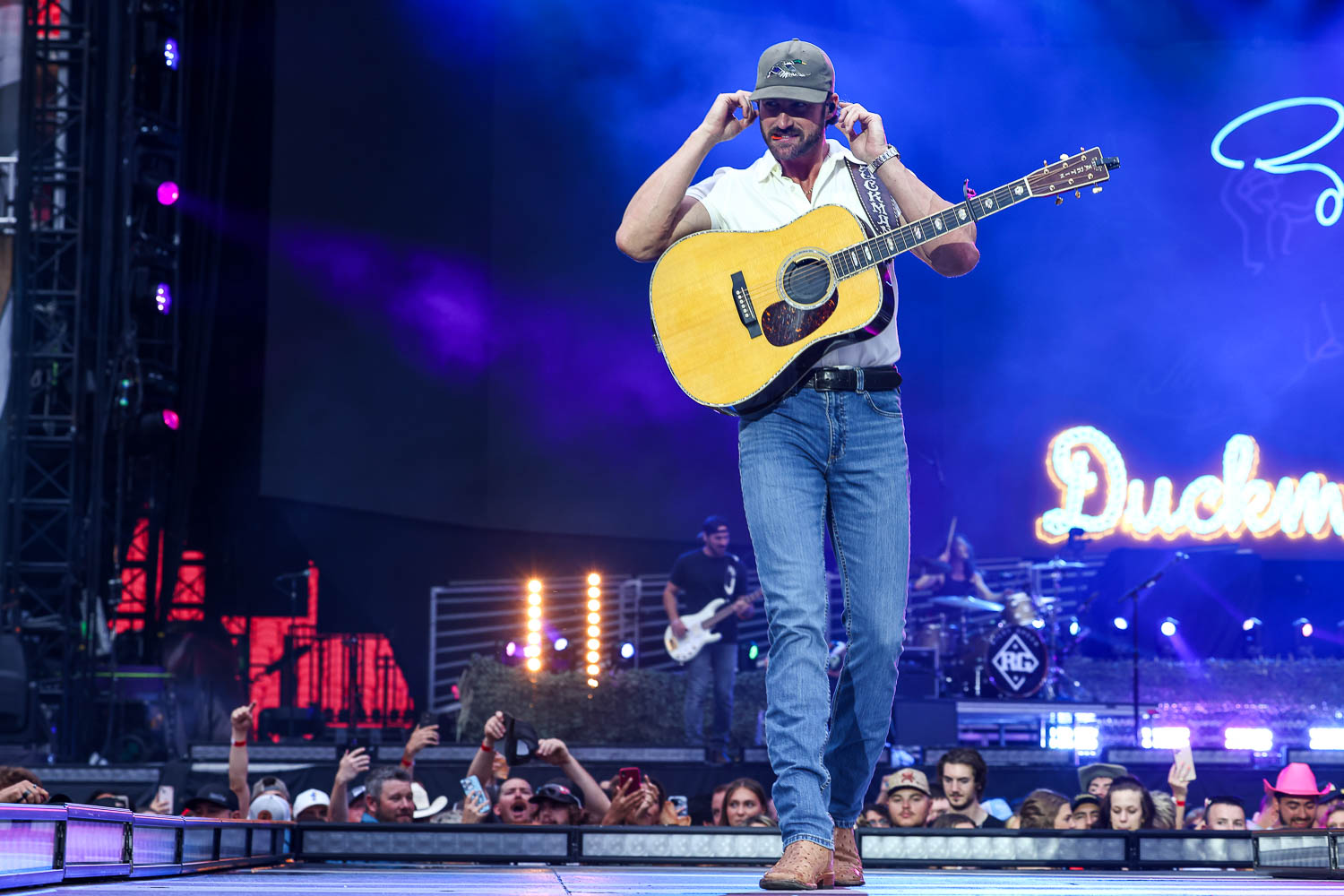 Riley Green live in concert with stadium lights